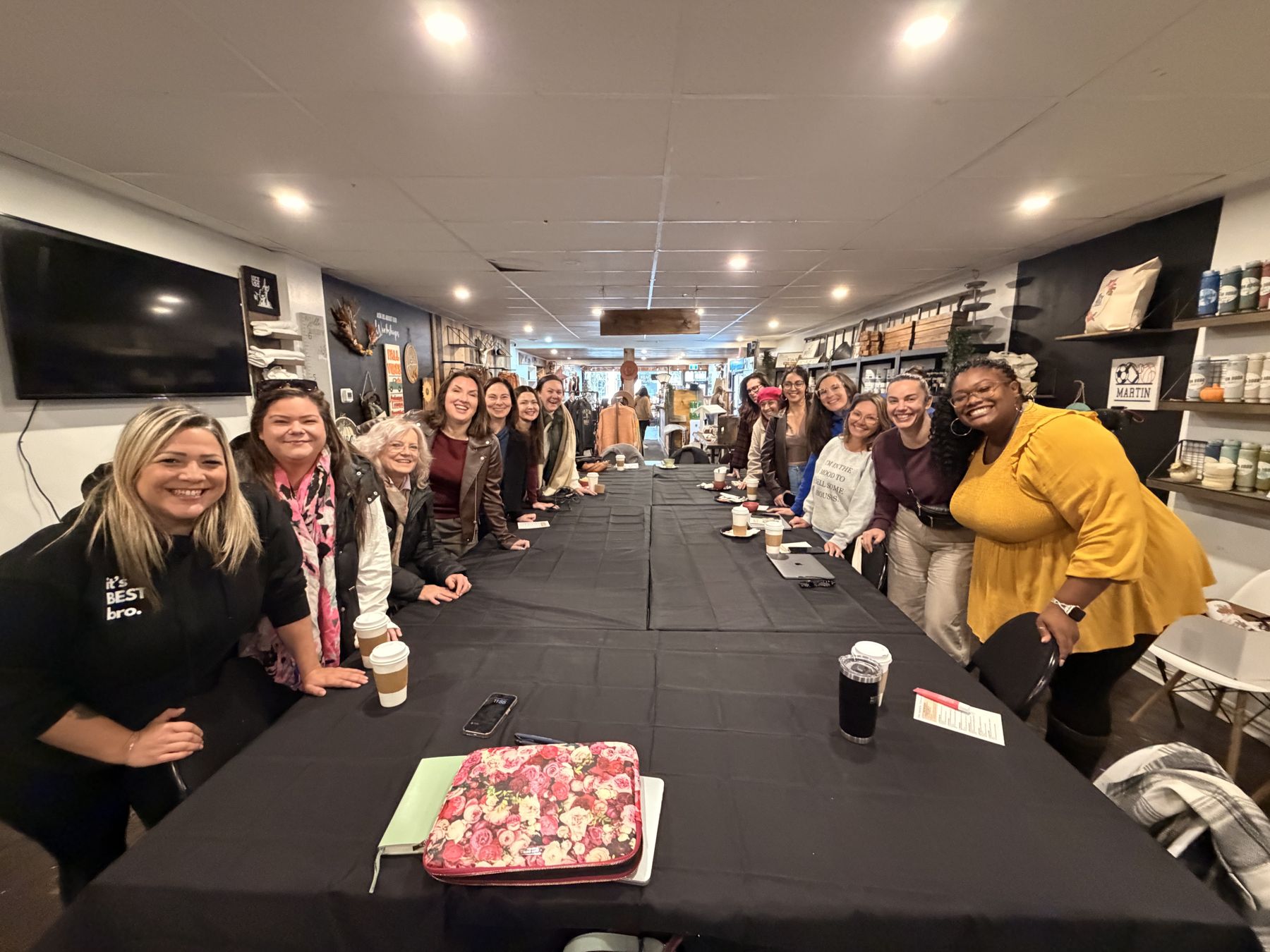 A full table of women at a We Rise coffee and coworking morning